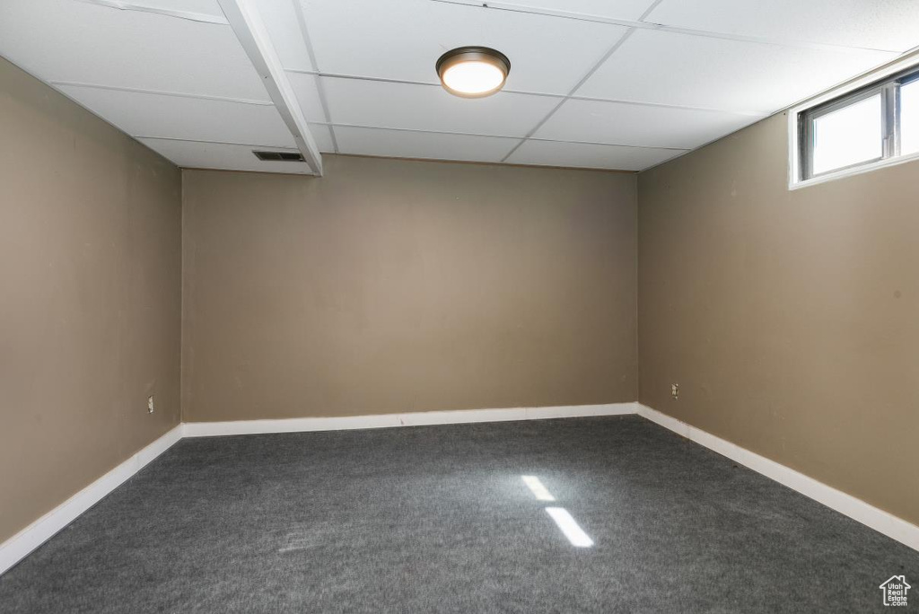 Below grade area with carpet and baseboards