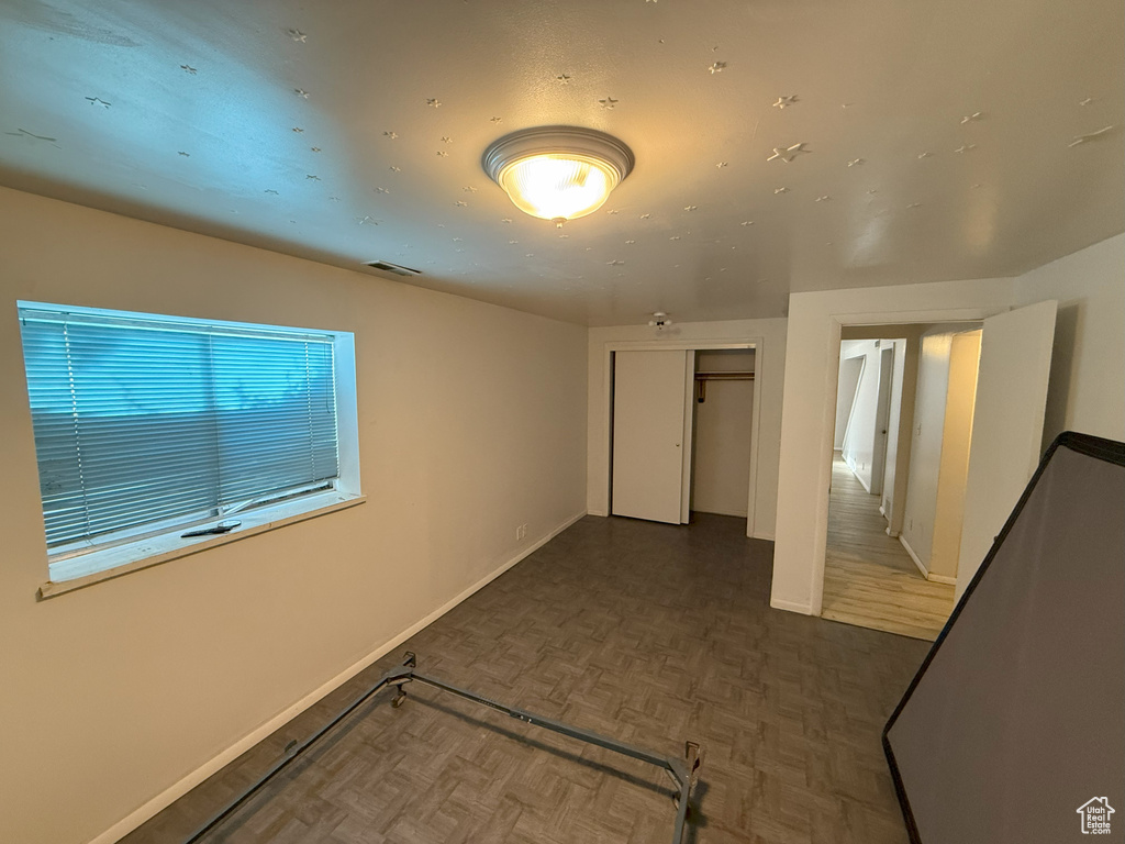 Empty room featuring baseboards