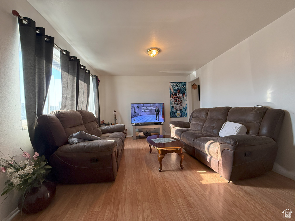 Living area with light wood-style flooring