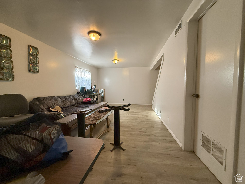 Living room featuring light wood finished floors and baseboards