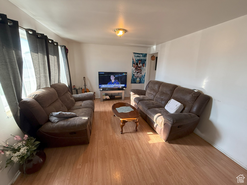 Living area with light wood-style flooring