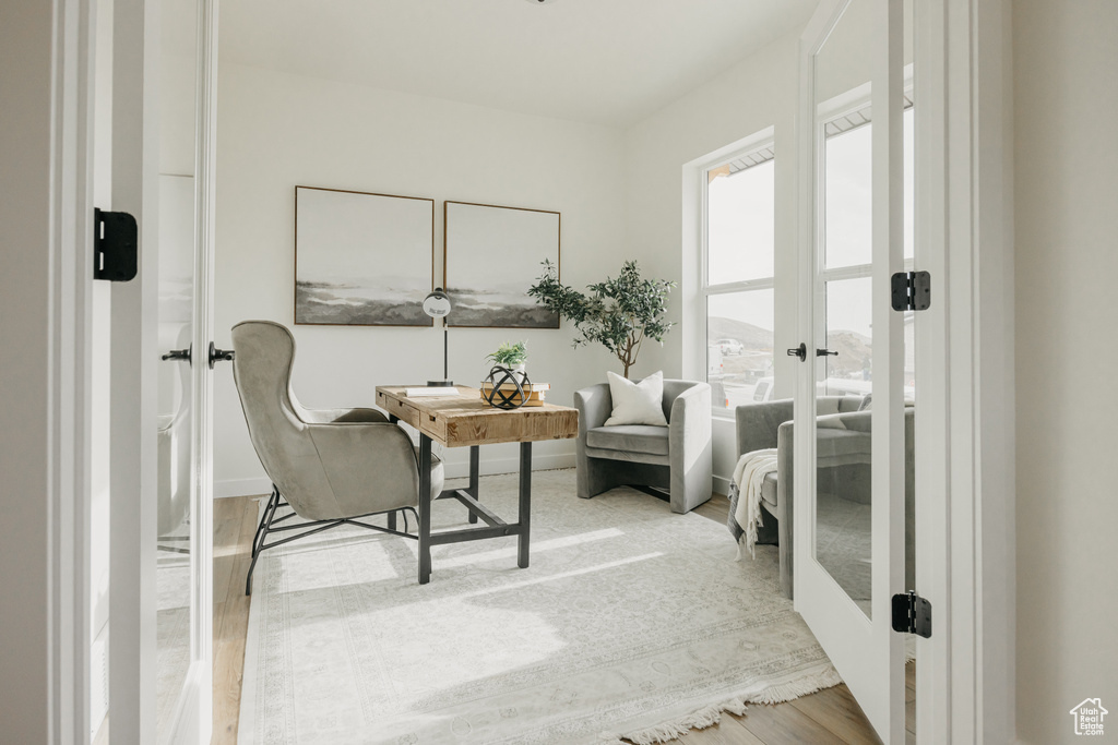 Office with french doors and wood finished floors