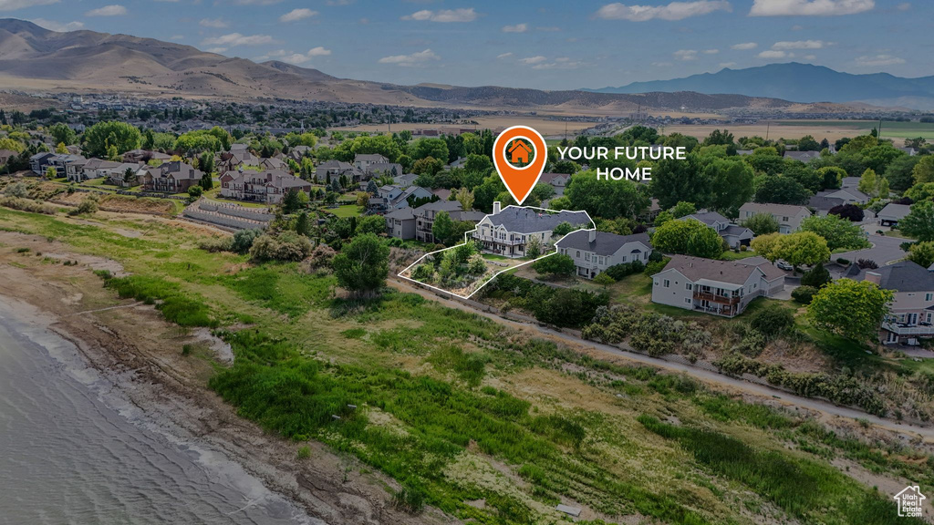 Aerial perspective of suburban area with a mountainous background