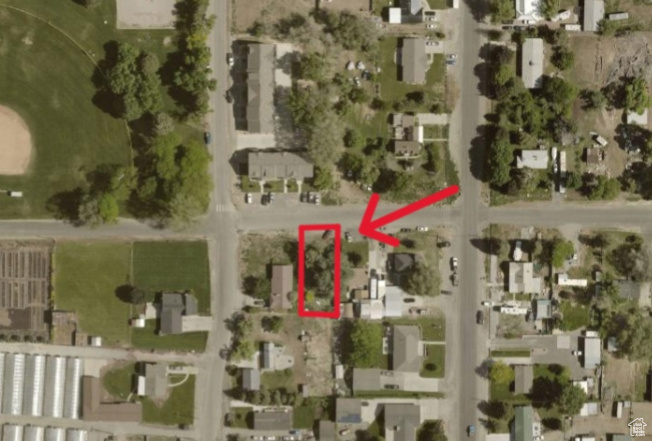 Aerial view of property's location with property boundaries highlighted and nearby suburban area
