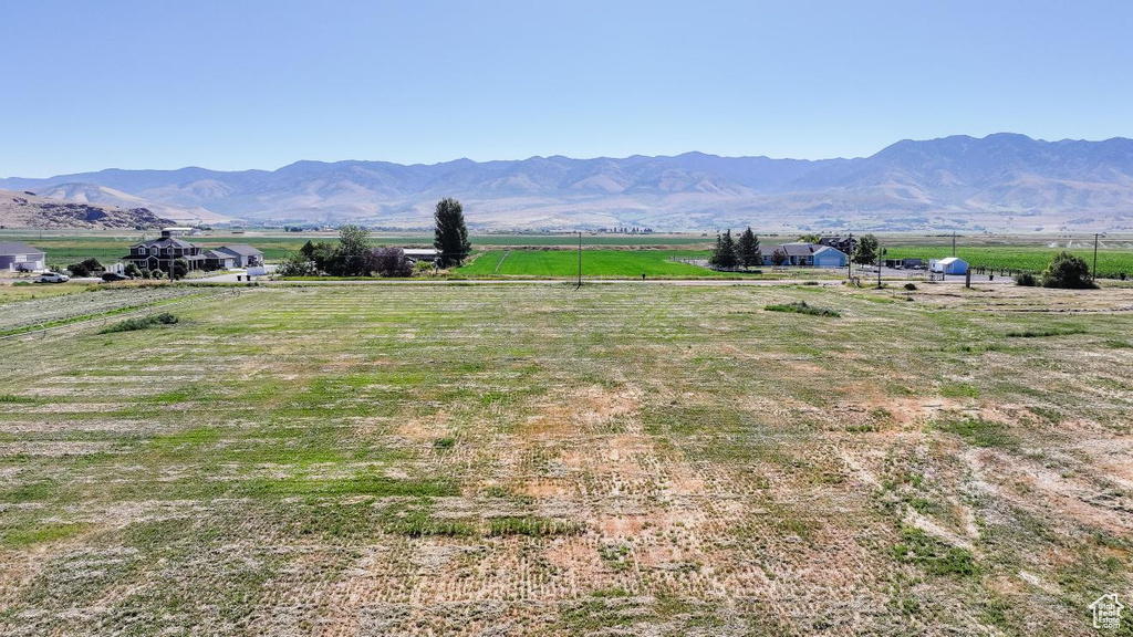 View of mountain backdrop featuring rural landscape