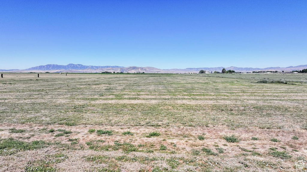 View of mountain background featuring rural landscape