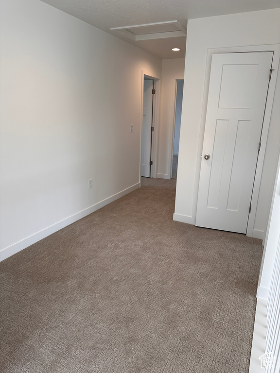 Unfurnished room with carpet floors and recessed lighting