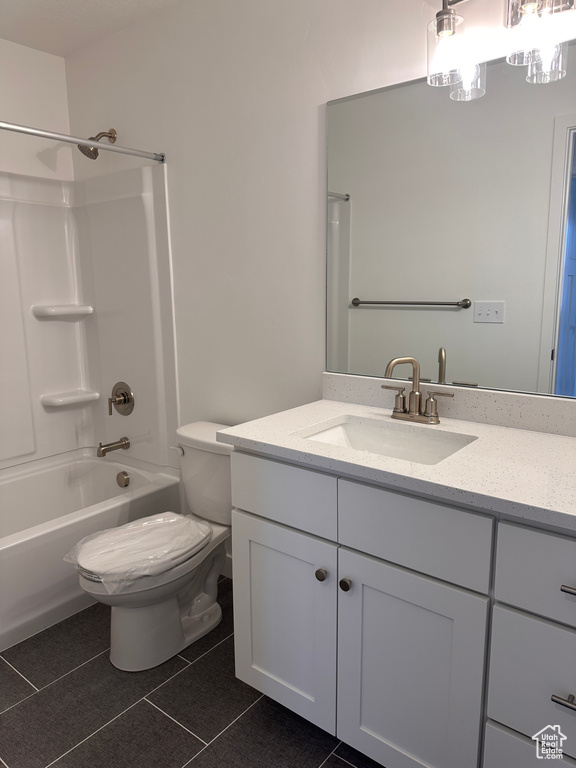 Full bathroom featuring vanity, bathtub / shower combination, and tile patterned floors