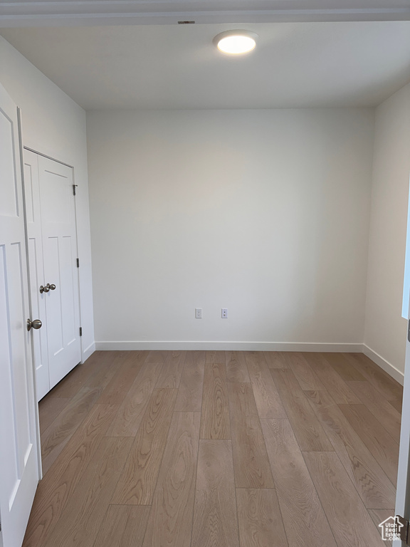 Empty room featuring light wood-type flooring