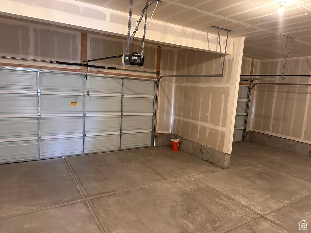 Garage featuring a garage door opener