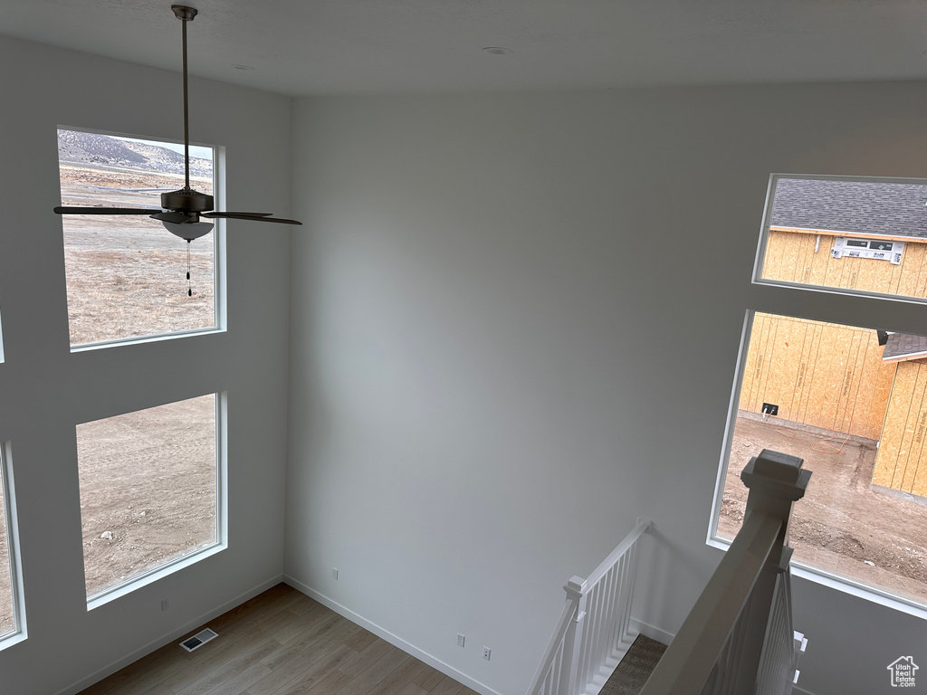 Empty room with wood finished floors and baseboards