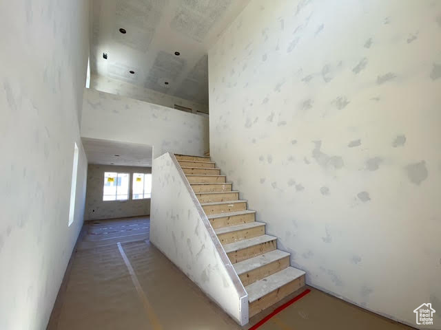 Stairway with a towering ceiling