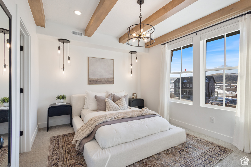 Carpeted bedroom featuring beamed ceiling, a chandelier, and recessed lighting