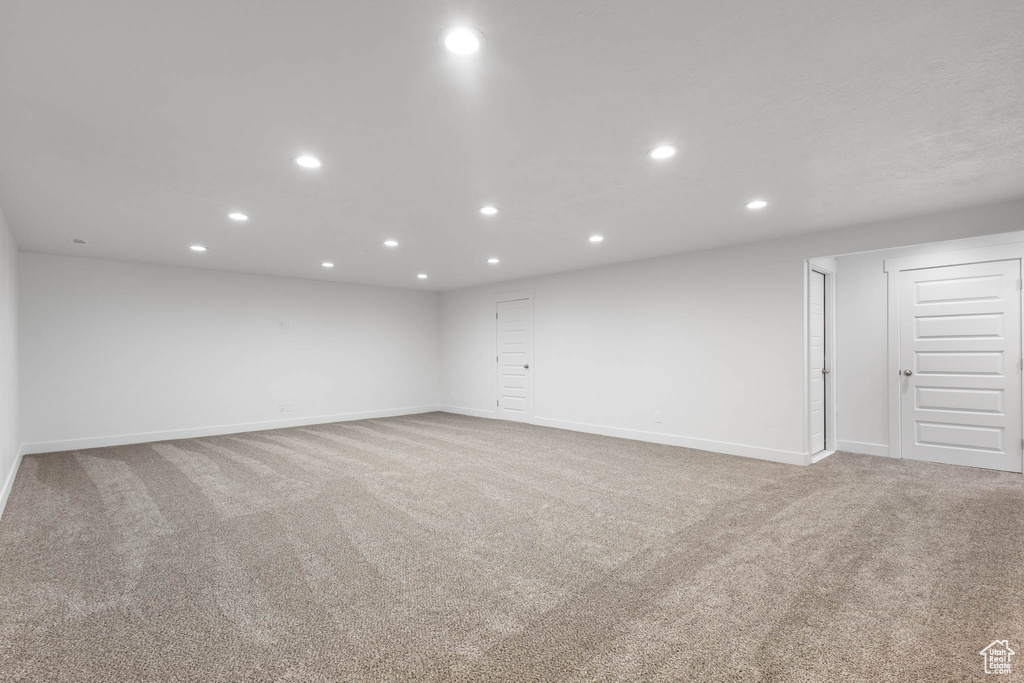 Unfurnished room featuring light colored carpet and recessed lighting