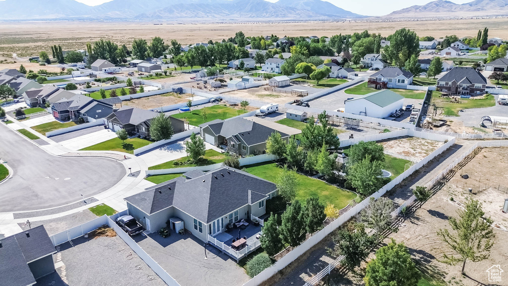 Aerial perspective of suburban area featuring a mountainous background