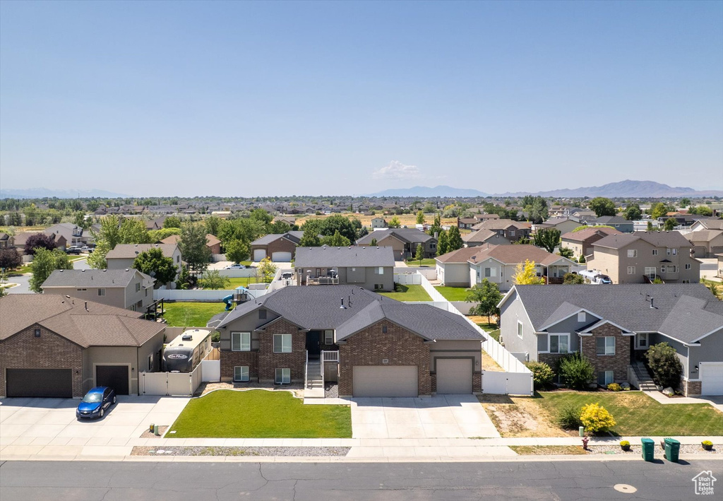 Aerial perspective of suburban area with a mountain backdrop