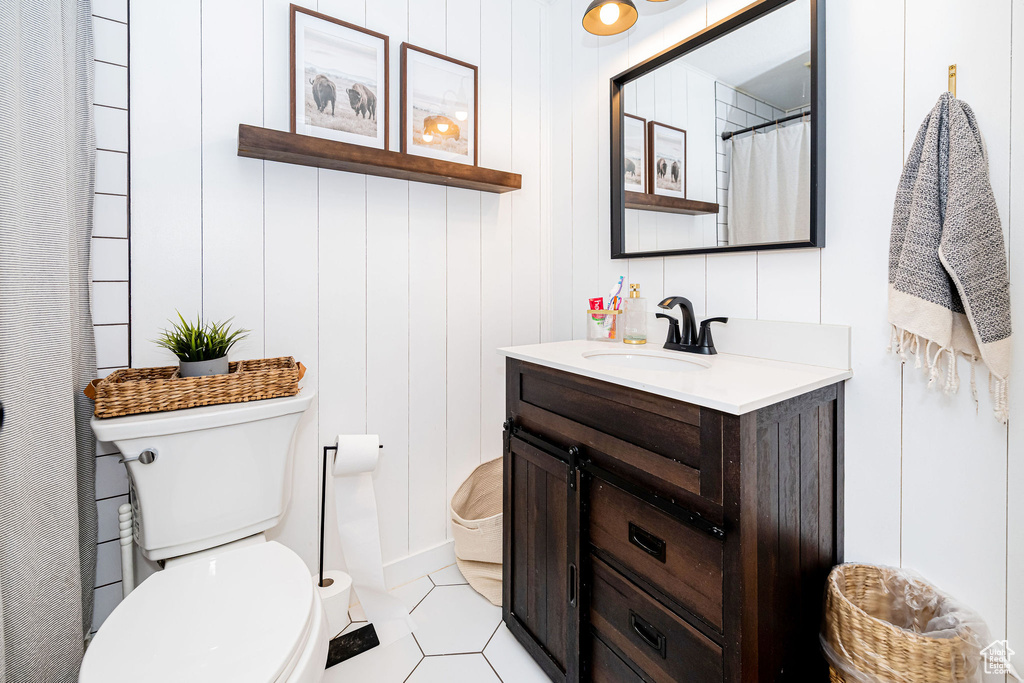 Full bathroom featuring vanity and tile patterned floors