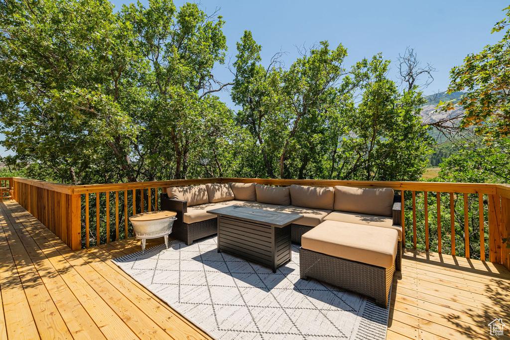 Wooden deck with an outdoor living space