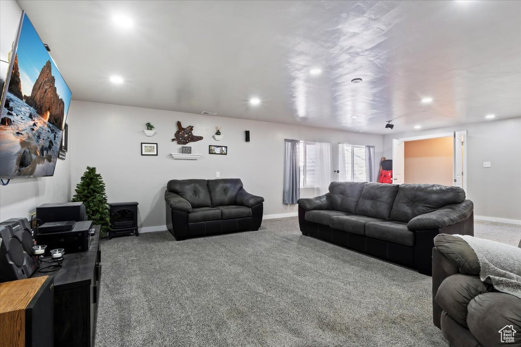 Carpeted living room with recessed lighting