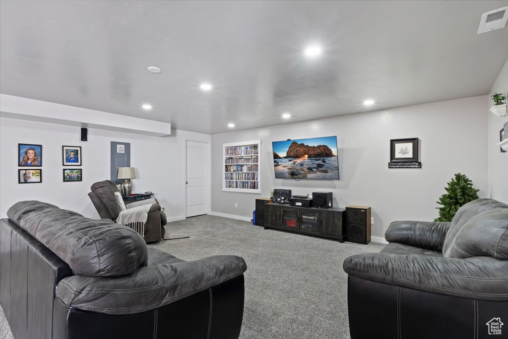 Living area with carpet and recessed lighting
