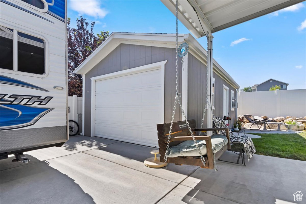 Garage with concrete driveway