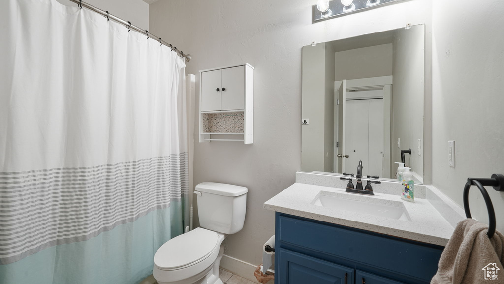 Full bathroom with vanity and a shower with shower curtain