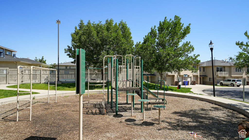 Community jungle gym featuring a residential view