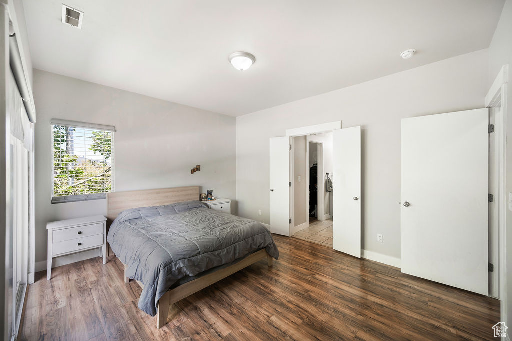 Bedroom with wood finished floors