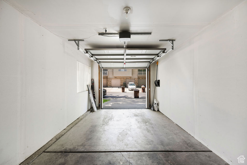 Garage featuring a garage door opener
