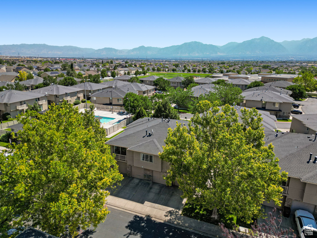 Aerial view of residential area featuring mountains