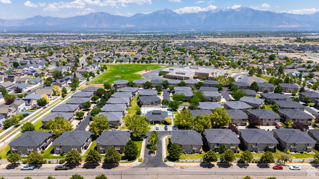 Aerial perspective of suburban area featuring a mountainous background