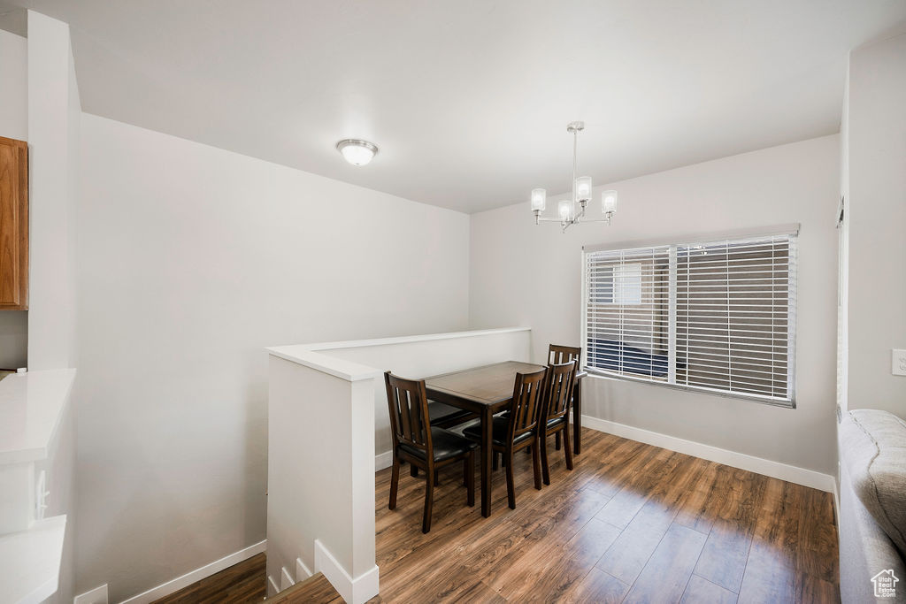 Dining room with a chandelier and wood finished floors