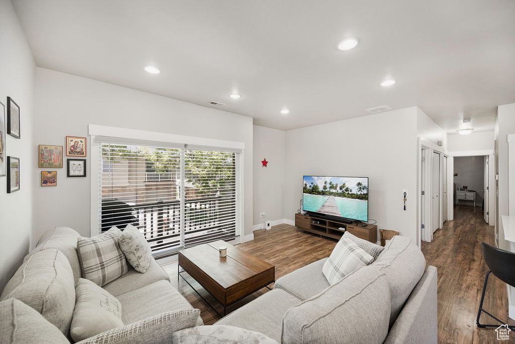 Living area with recessed lighting and wood finished floors