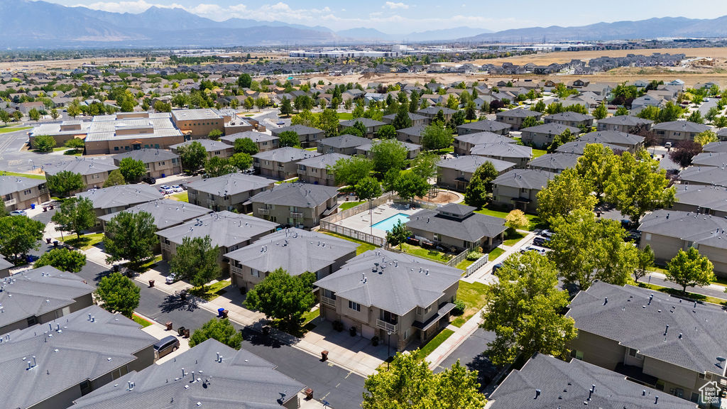 Aerial view of residential area featuring a mountainous background