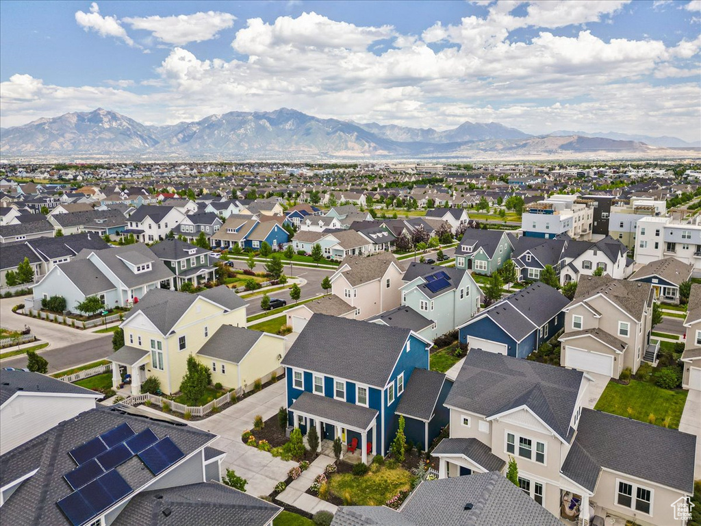 Aerial perspective of suburban area featuring a mountain backdrop