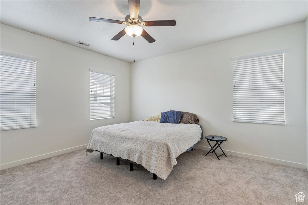 Bedroom featuring carpet and a ceiling fan