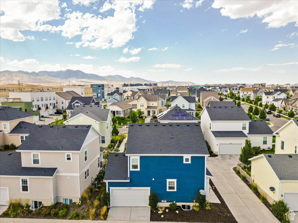 Aerial perspective of suburban area featuring a mountain backdrop