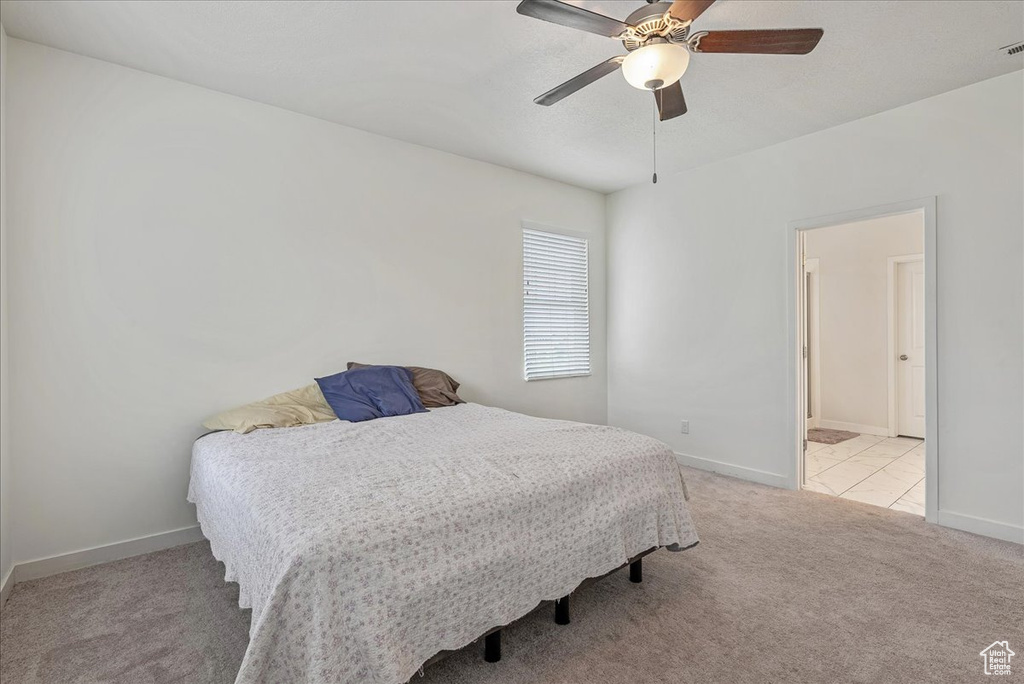 Bedroom with carpet flooring and ceiling fan