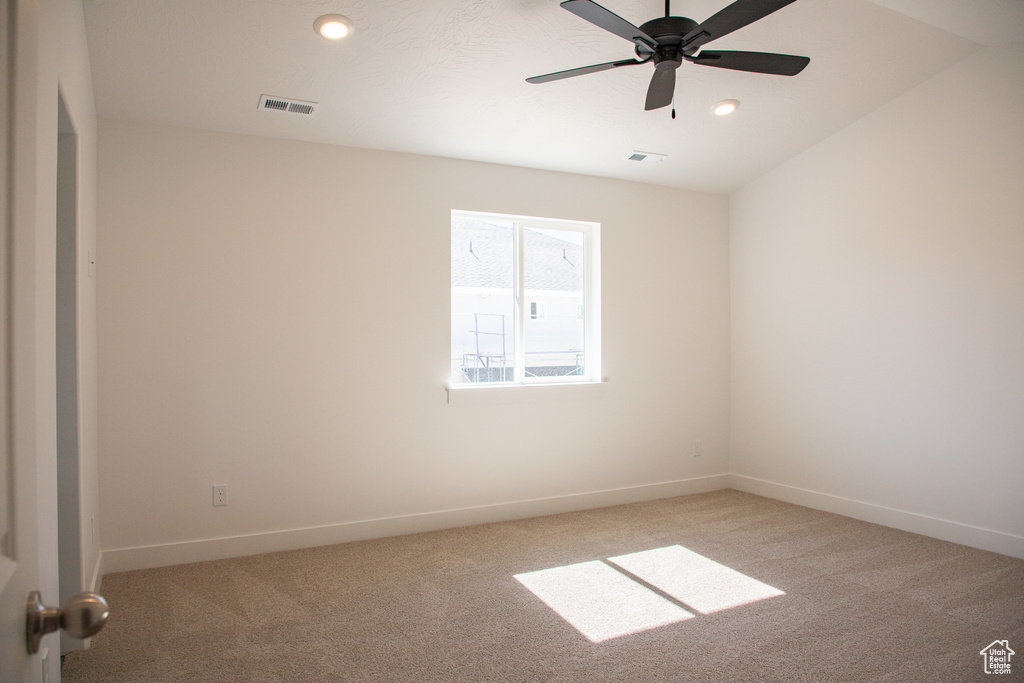 Empty room with light colored carpet, recessed lighting, and ceiling fan