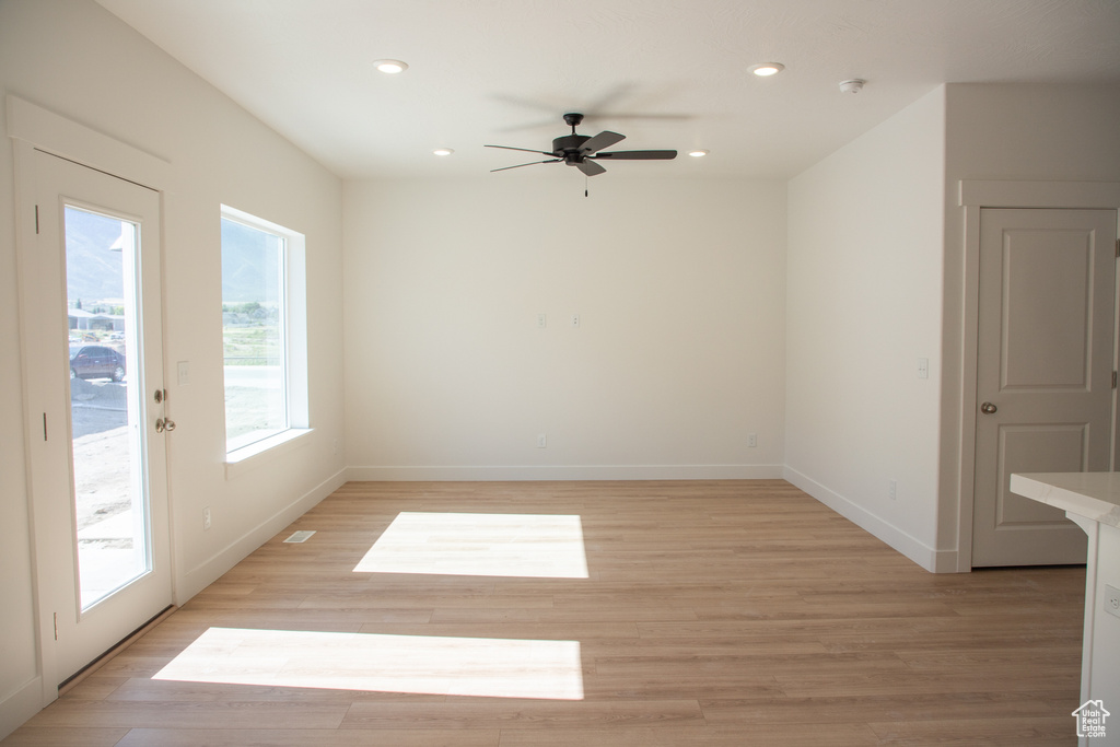 Spare room with ceiling fan, recessed lighting, light wood-type flooring, and a smoke detector