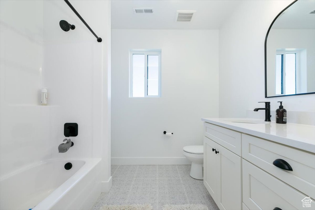 Full bathroom featuring vanity and bathing tub / shower combination