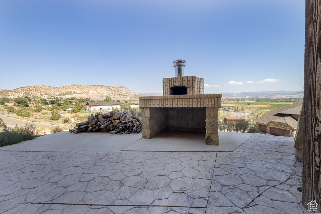 View of patio with a mountain view