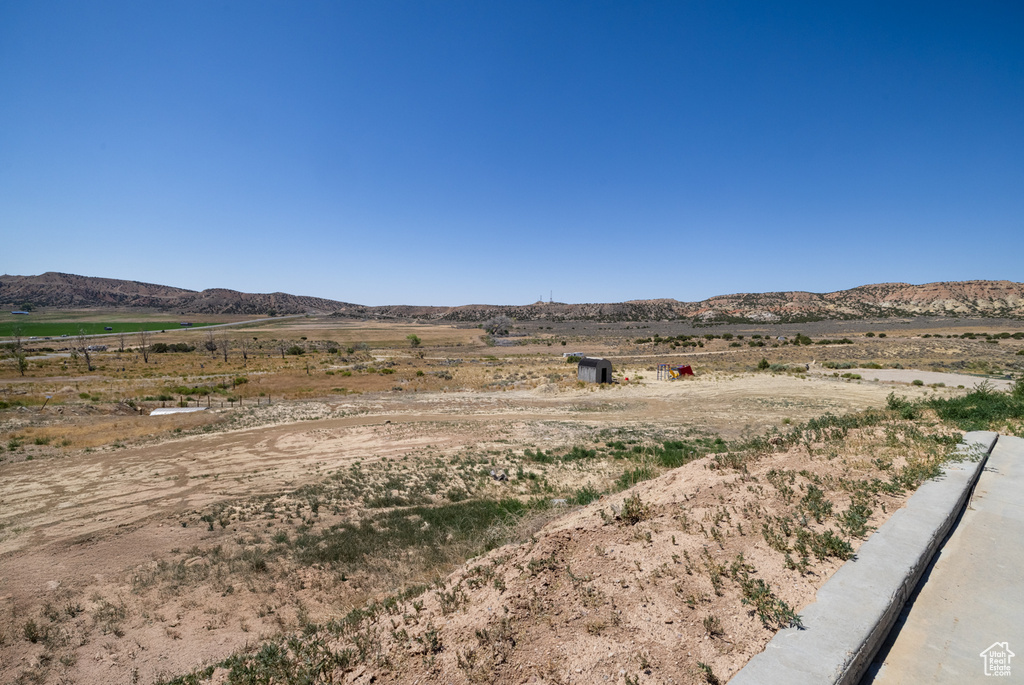 View of mountain background featuring rural landscape