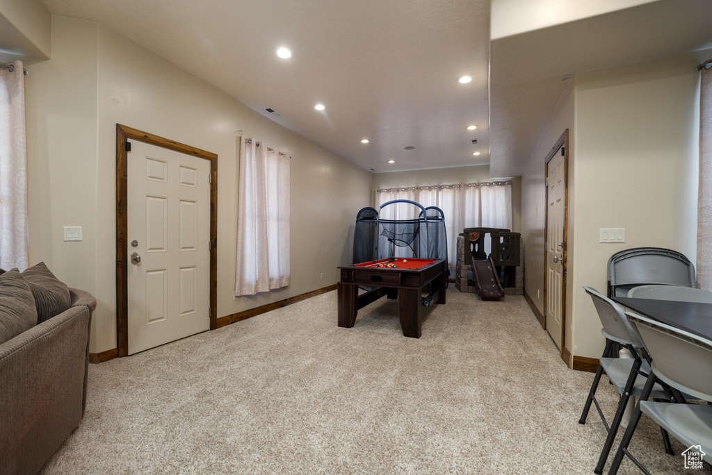 Playroom featuring light colored carpet, recessed lighting, and billiards