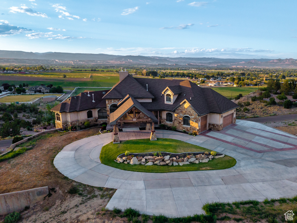 View of subject property featuring a mountain backdrop