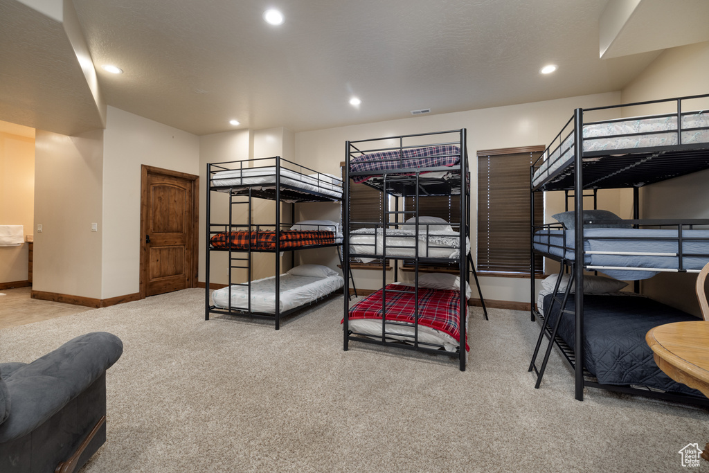 Bedroom with carpet floors and recessed lighting