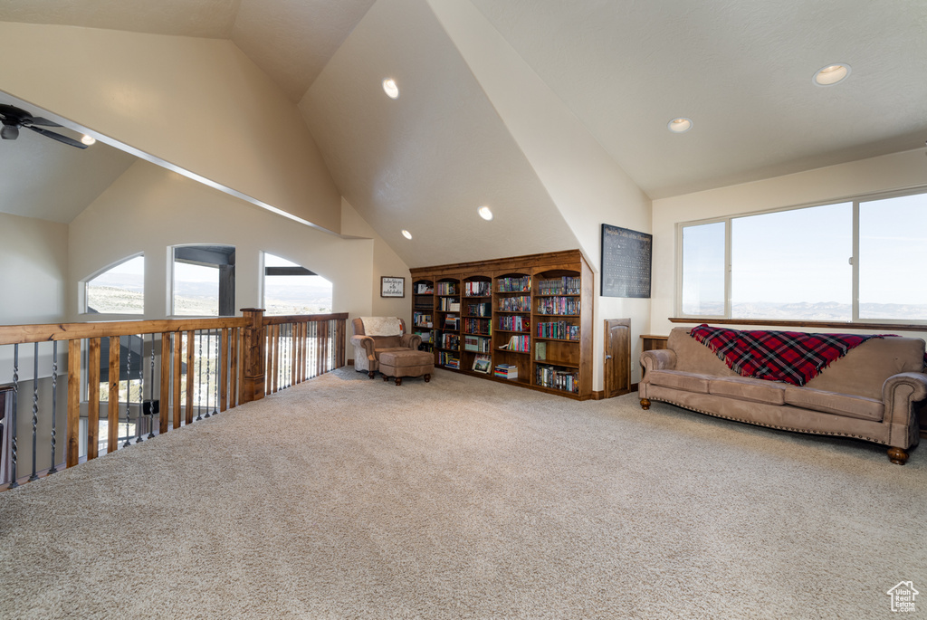 Living area featuring carpet, high vaulted ceiling, a ceiling fan, and recessed lighting