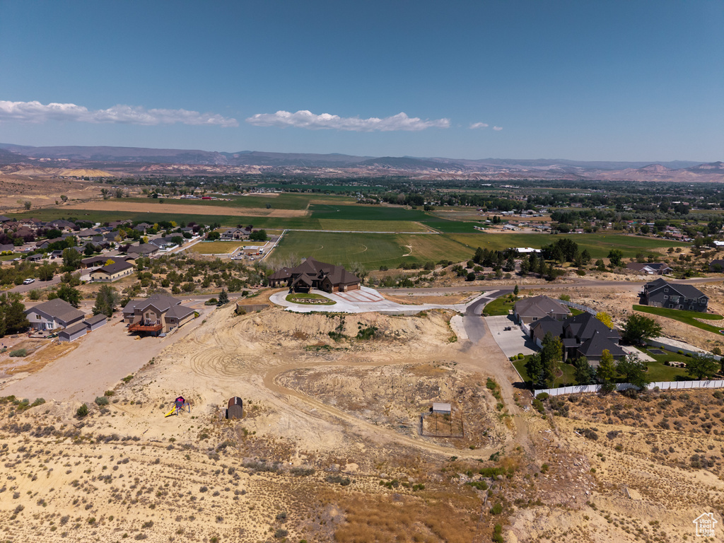 Overview of rural landscape featuring a mountainous background