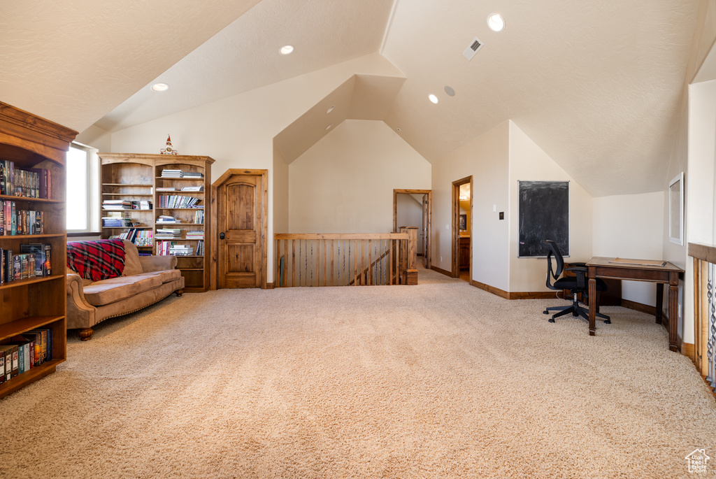 Sitting room featuring carpet flooring, an upstairs landing, vaulted ceiling, a desk, and recessed lighting