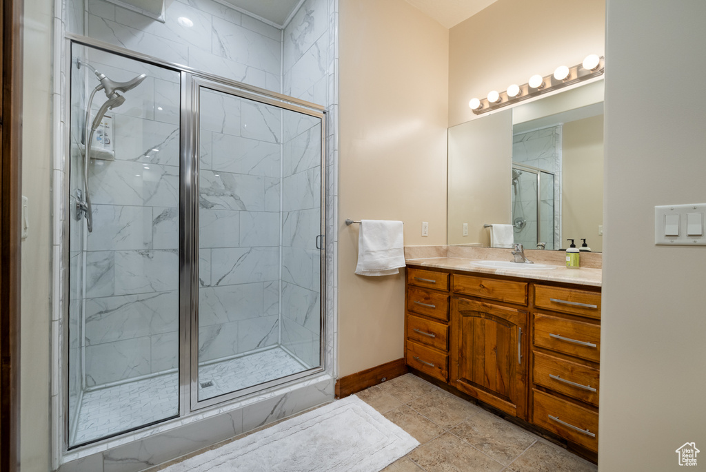 Bathroom with a stall shower and vanity
